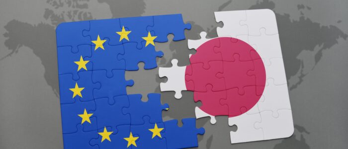 puzzle with the national flag of japan and european union on a world map