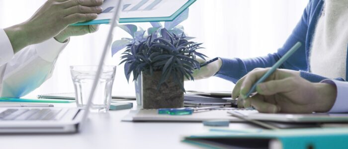 Four people have a business strategy meeting